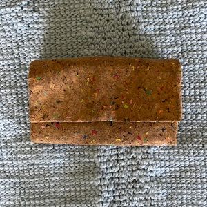 Cork style wallet with rainbow specks.